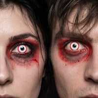 Man and woman wearing Psycho contact lenses with hollow-eyed red-rimmed Halloween makeup