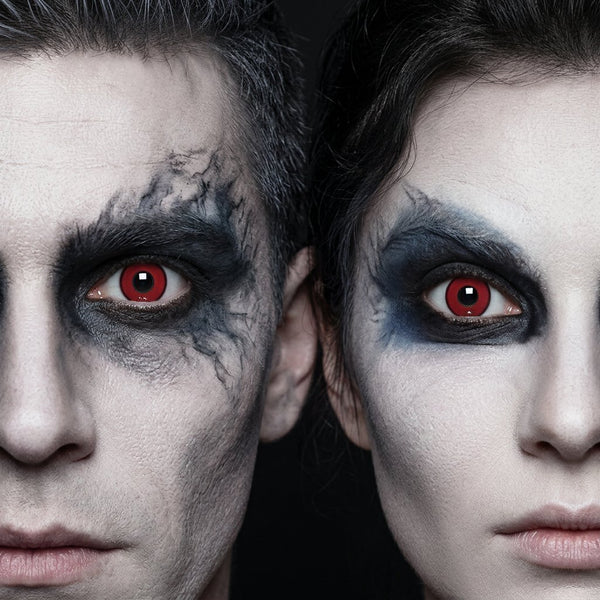 Man and woman wearing Freak contact lenses with heavy charcoal-black smoky Halloween makeup