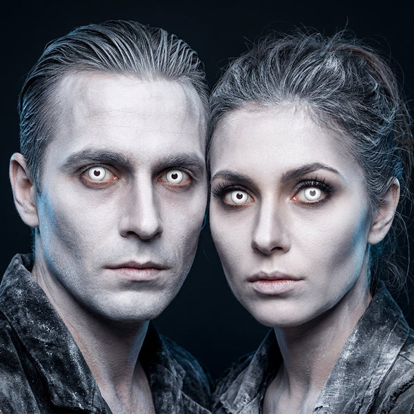 Man and woman wearing Ghost contact lenses with ghostly white Halloween makeup