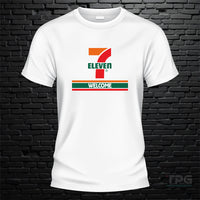 7 11 graphic T-shirt welcome sign graphic on white brick wall