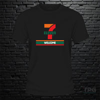 7 11 graphic T-shirt welcome sign graphic on black brick wall