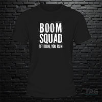 Boom Squad graphic T-shirt mockup on black brick wall