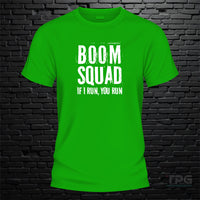 Boom Squad graphic T-shirt mockup on green brick wall